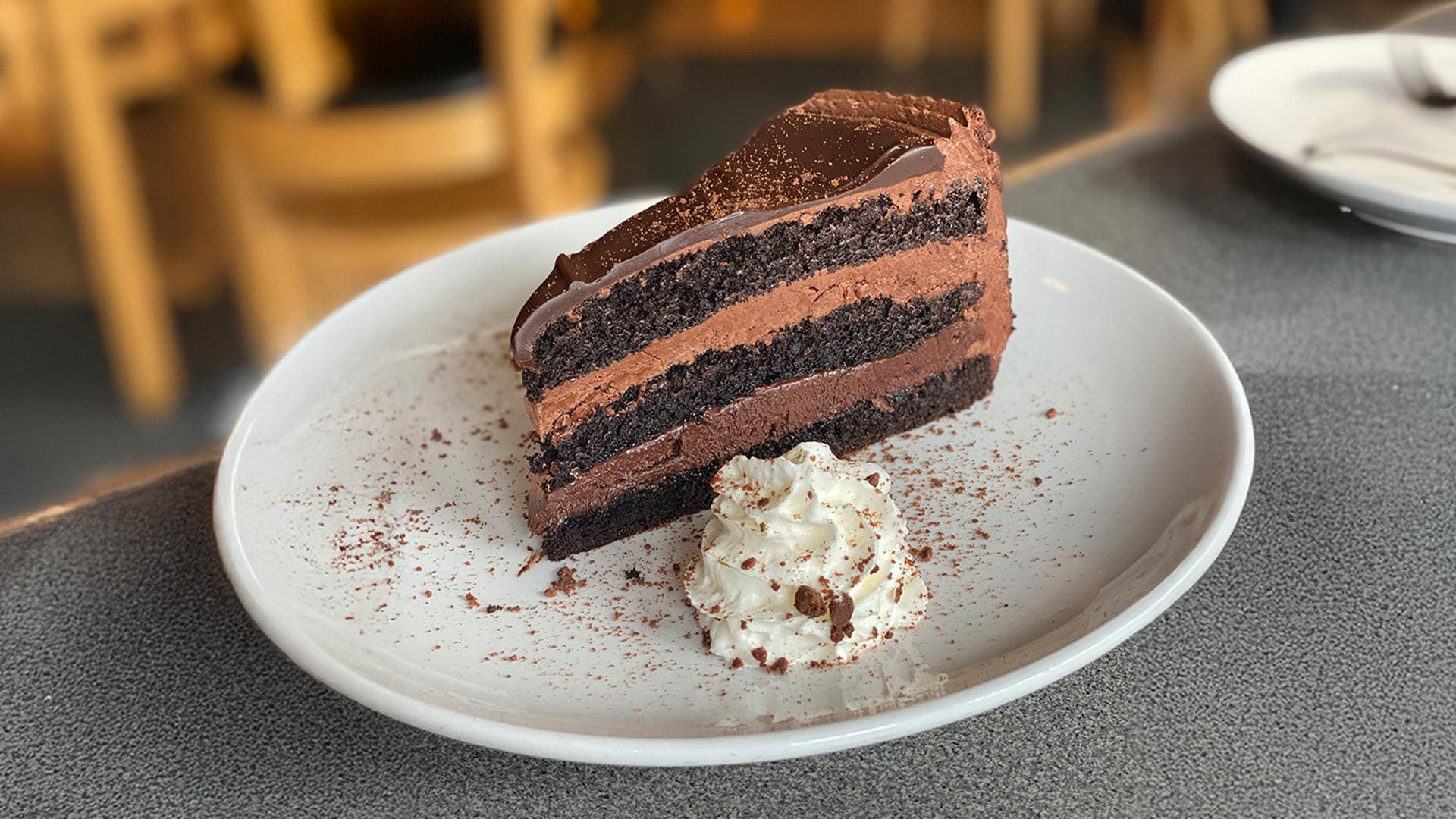 Triple layer chocolate cake with layers of buttercream and ganache
