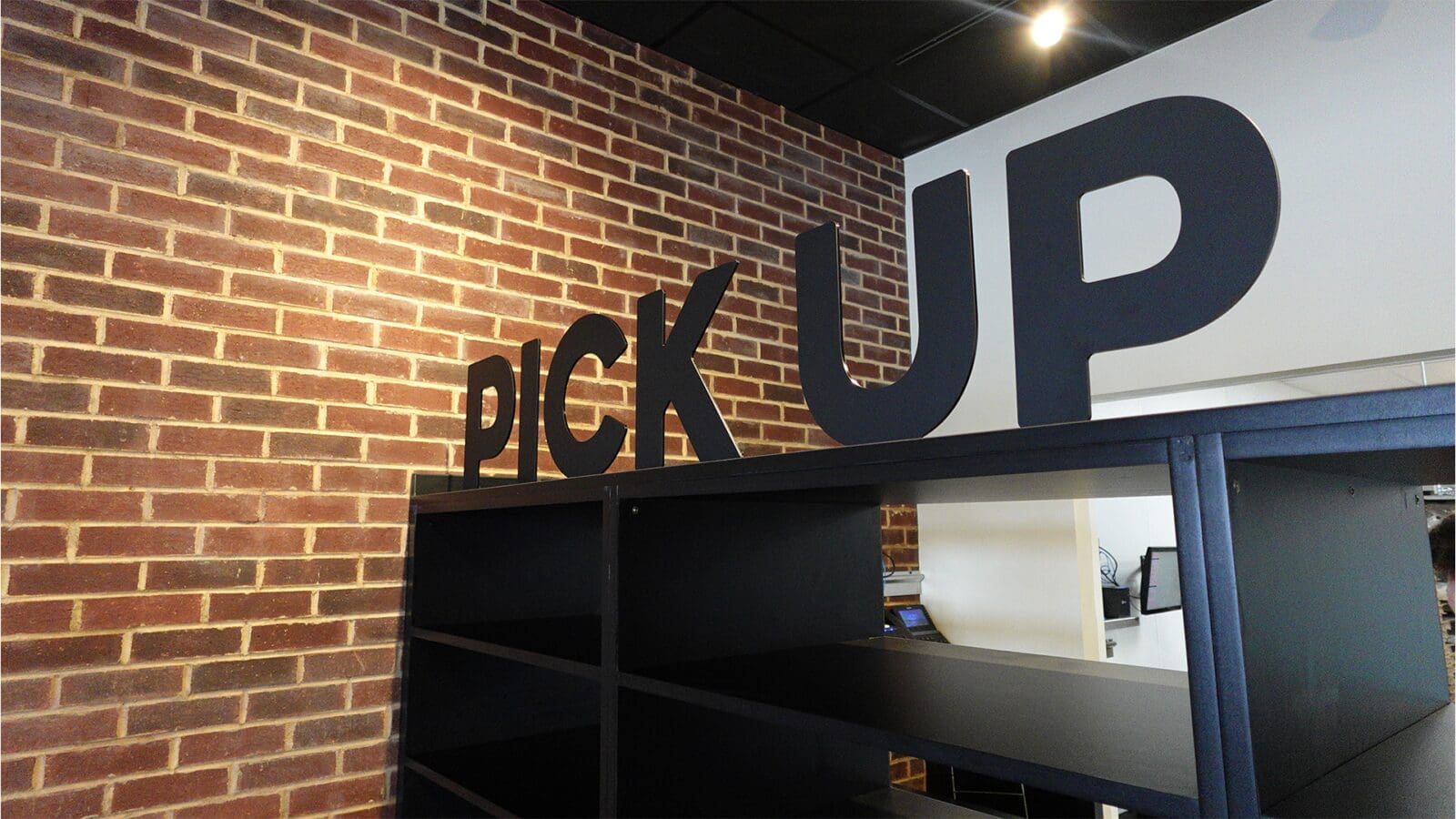 Large black 3D block lettering spelling 